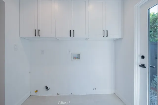 a bathroom with a granite countertop toilet and a sink