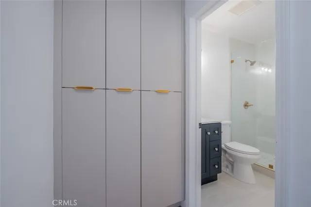 a bathroom with a toilet a sink and shower