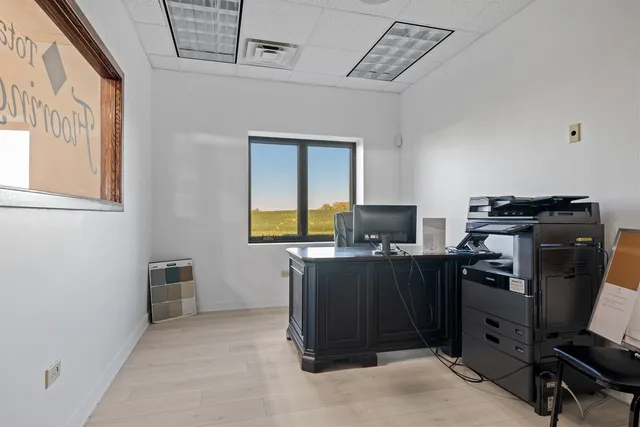 a bathroom with a sink toilet and a mirror
