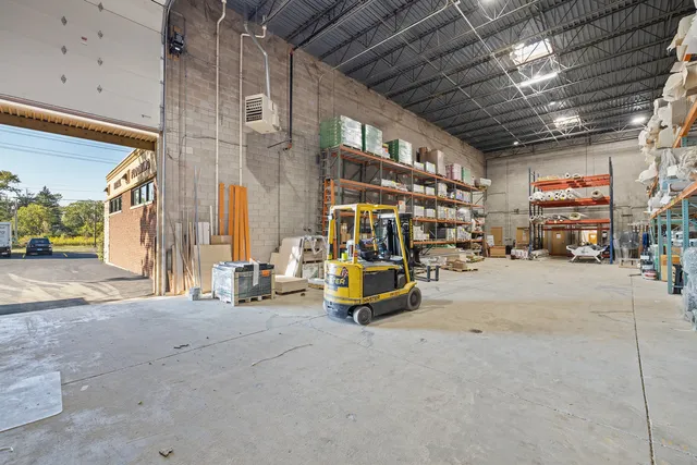 a view of tall building with large trees