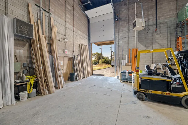 a view of a living room with furniture and a fireplace