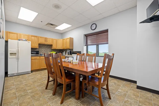 a workspace with furniture and a window