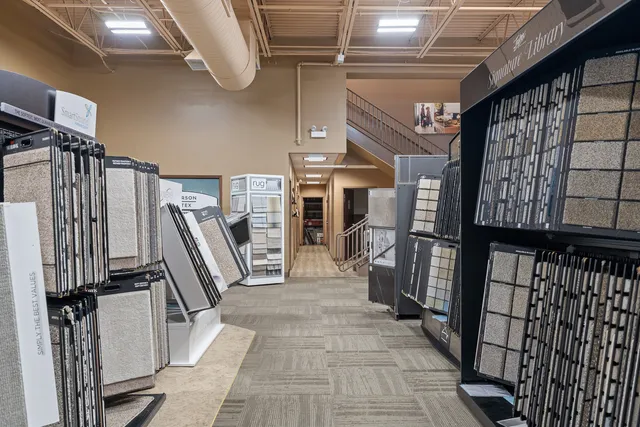 a view of a hallway with wooden floors