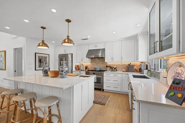 a large kitchen with granite countertop lots of counter top space