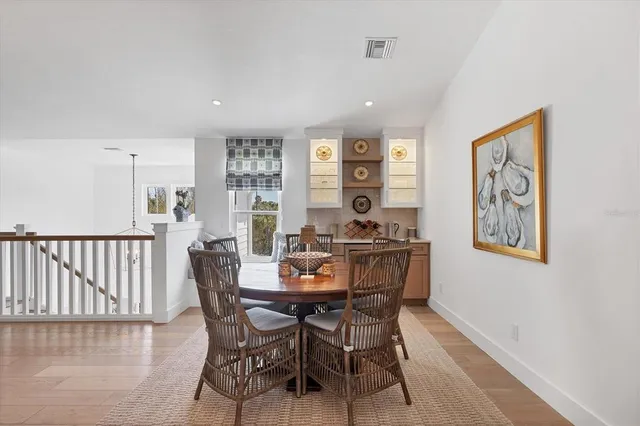 a dining room with furniture and window