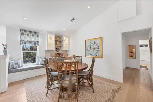 a dining room with furniture window wooden floor