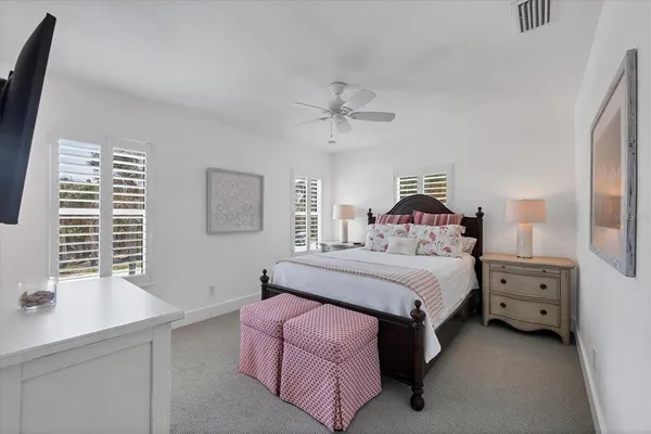 a bedroom with a bed and a night stand