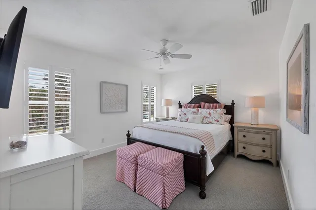 a bedroom with a bed and a night stand