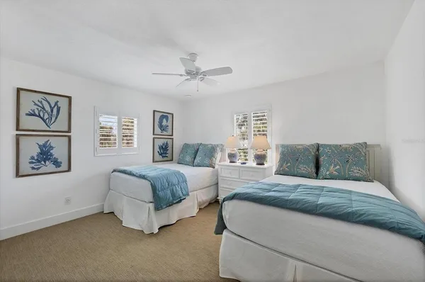 a living room with a bed furniture and a window