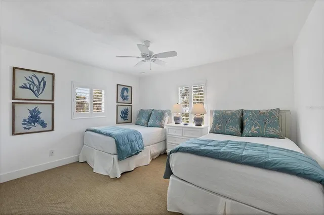 a living room with a bed furniture and a window