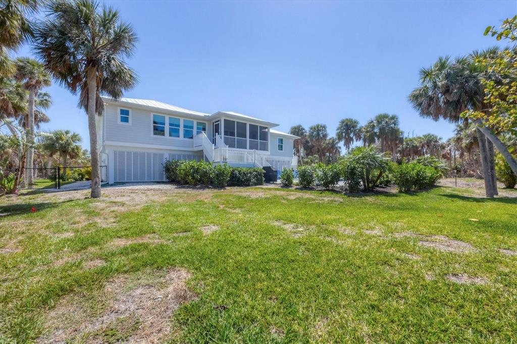 355 Barbarossa Street Boca Grande, FL 33921 - Photo 39 of 47 a front view of a house with garden