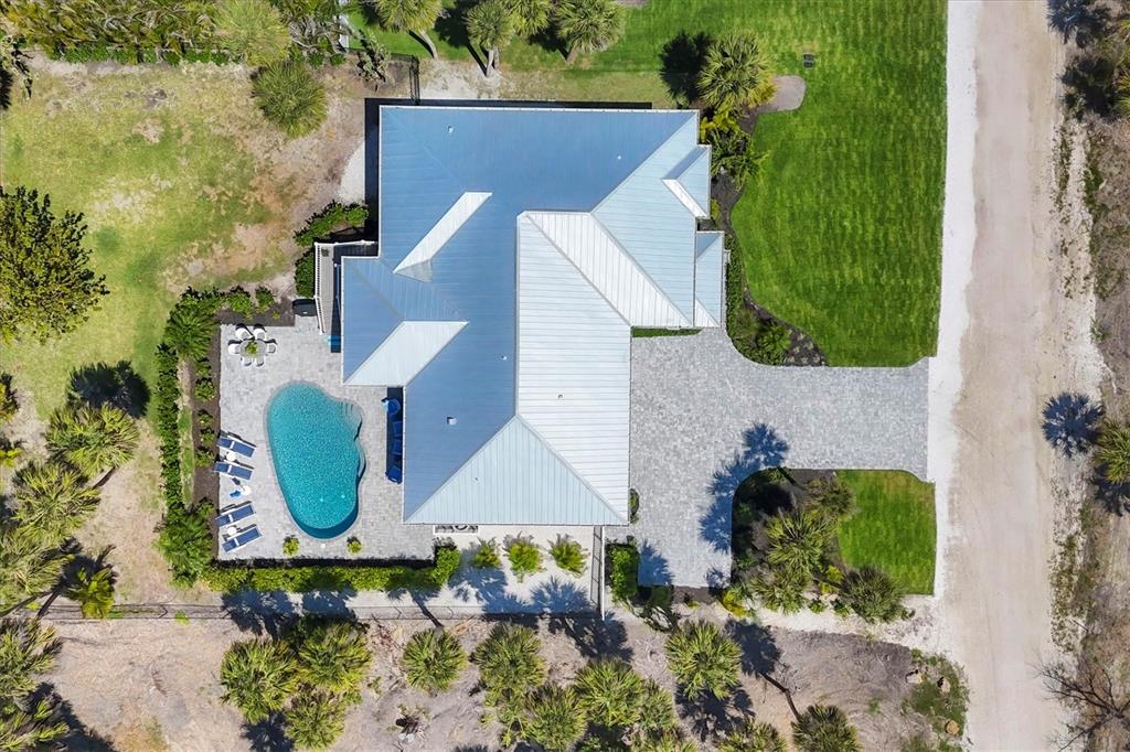 355 Barbarossa Street Boca Grande, FL 33921 - Photo 40 of 47 an aerial view of a house with swimming pool and large trees