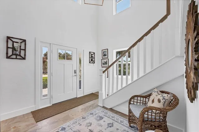 a view of a livingroom with wooden floor and a window