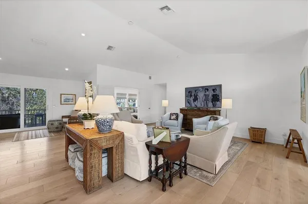 a living room with fireplace furniture and a wooden floor