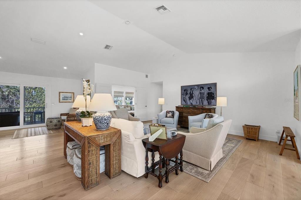 355 Barbarossa Street Boca Grande, FL 33921 - Photo 9 of 47 a living room with fireplace furniture and a wooden floor