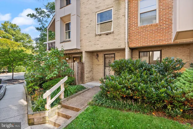 a front view of a house with a yard garage and outdoor seating