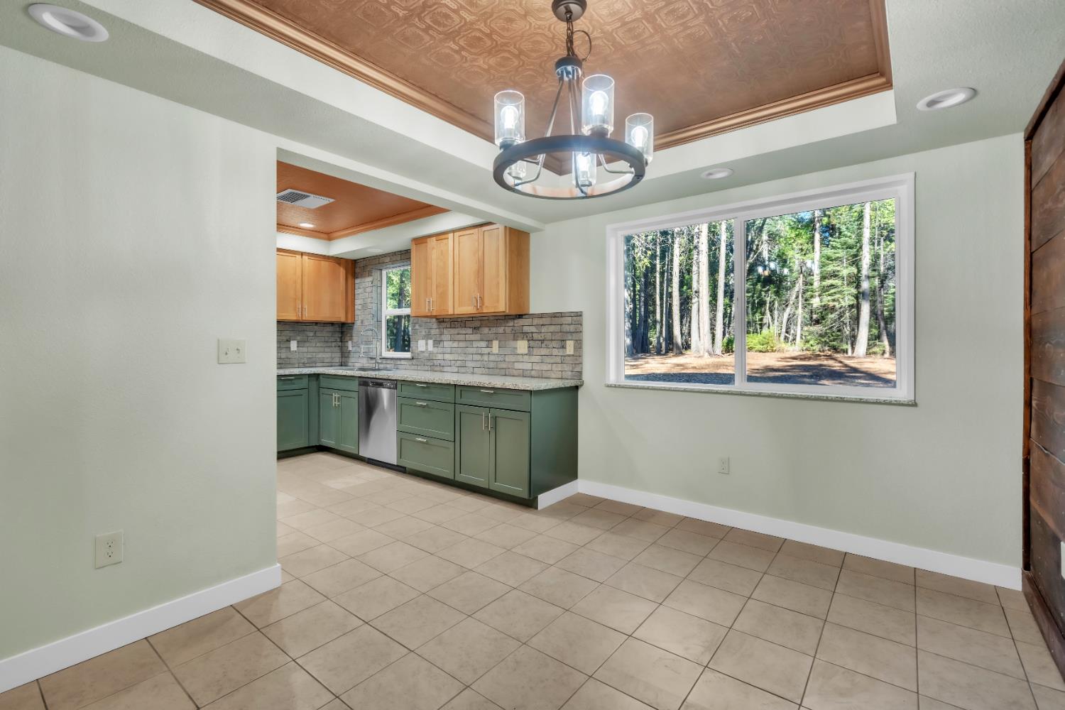 740 Hideaway Loop Alta, CA 95701 - Photo 14 of 74 a kitchen with stainless steel appliances a stove and cabinets