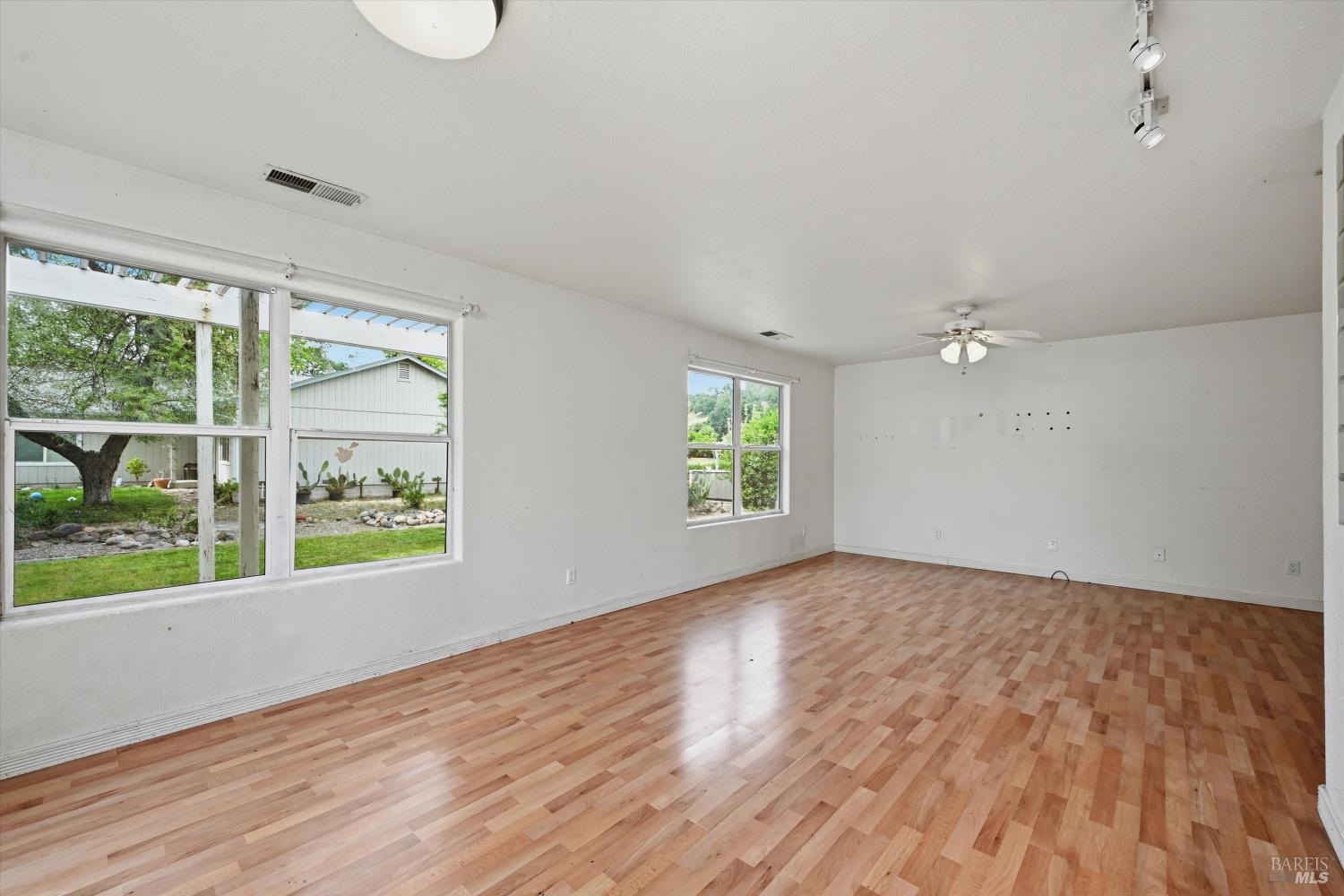 18057 Spyglass Road Hidden Valley Lake, CA 95467 - Photo 7 of 29 Large living area with lots of windows.