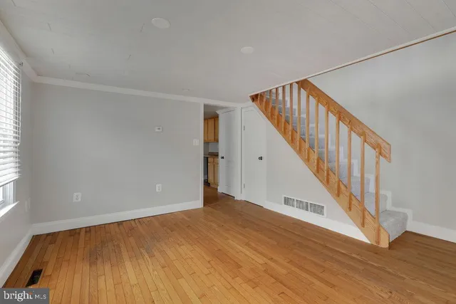a view of an entryway with wooden floor