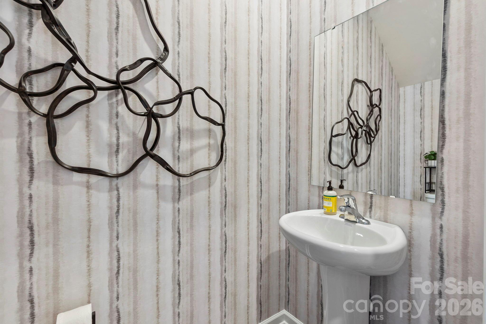 8034 Midas Lane Locust, NC 28097 - Photo 5 of 27 a bathroom with a sink and a mirror