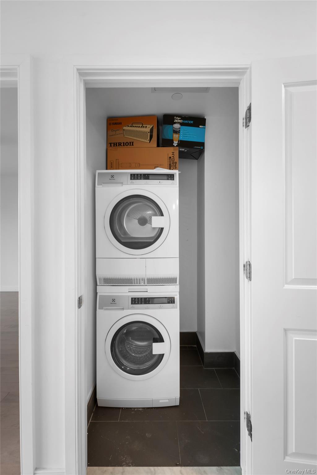 41-04 27th Street, Unit 6A Queens, NY 11101 - Photo 12 of 17 a utility room with dryer and washer