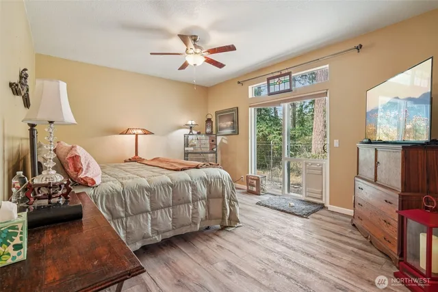 a bedroom with a large bed and a window