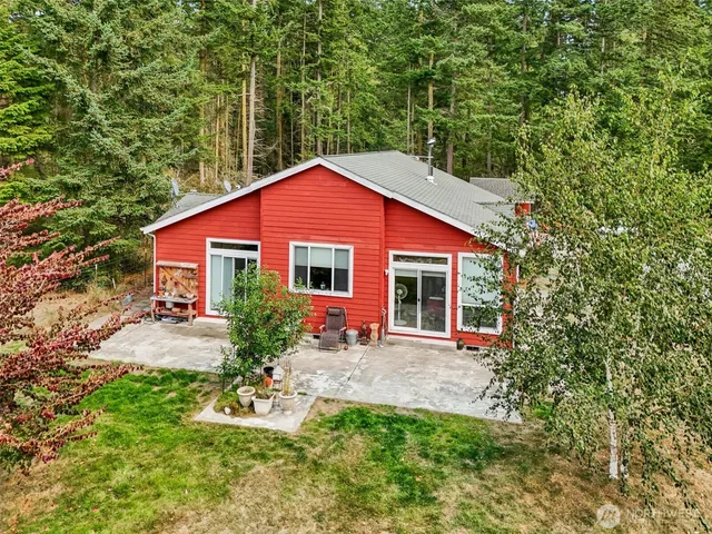 a backyard of a house with seating space