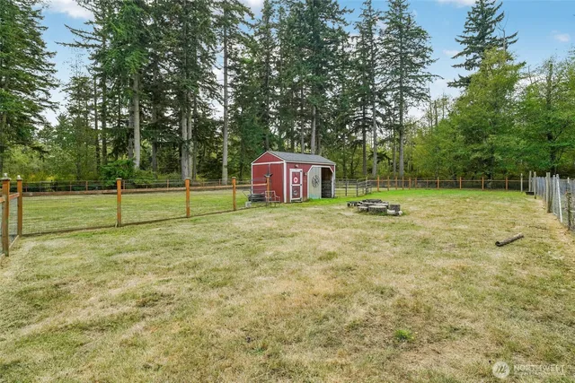 a view of outdoor space with deck and trees