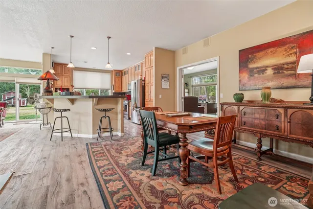 a view of a dining room with furniture window and wooden floor