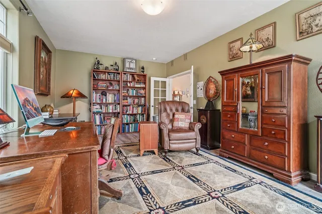 a view of a workspace with furniture