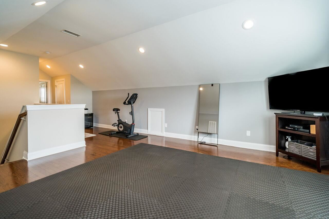 5268 Aleppo Lane Raleigh, NC 27613 - Photo 26 of 30 Third floor features spacious rec room, attic storage space, bedroom and full bathroom! Third Floor Rec Room