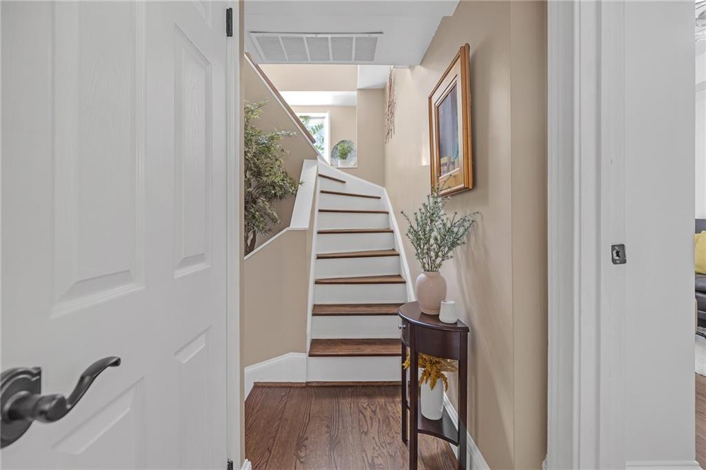 30 5th Street Northeast, Unit 102 Atlanta, GA 30308 - Photo 18 of 25 a view of staircase with wooden floor and stairs