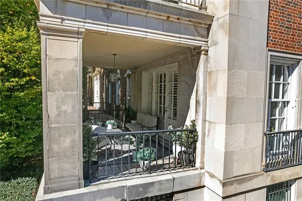 a swimming pool with outdoor seating and yard