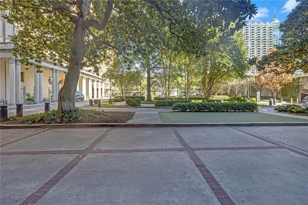 a view of a street with tall buildings