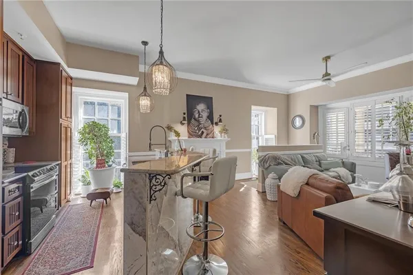 a view of a dining room with furniture window and wooden floor