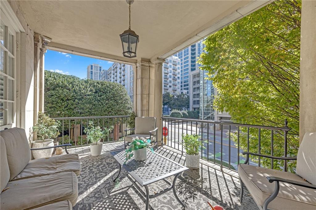 30 5th Street Northeast, Unit 102 Atlanta, GA 30308 - Photo 7 of 25 a view of a porch with furniture
