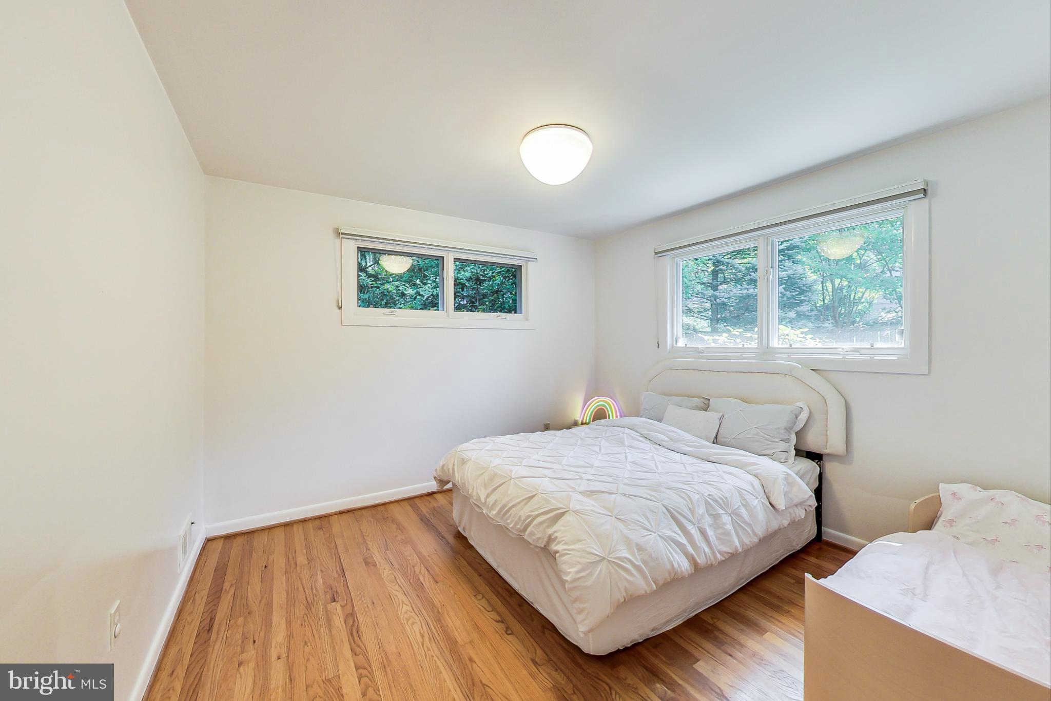 6515 East Halbert Road Bethesda, MD 20817 - Photo 27 of 42 a bedroom with a bed and a window
