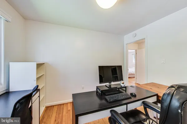 a view of a workspace with furniture