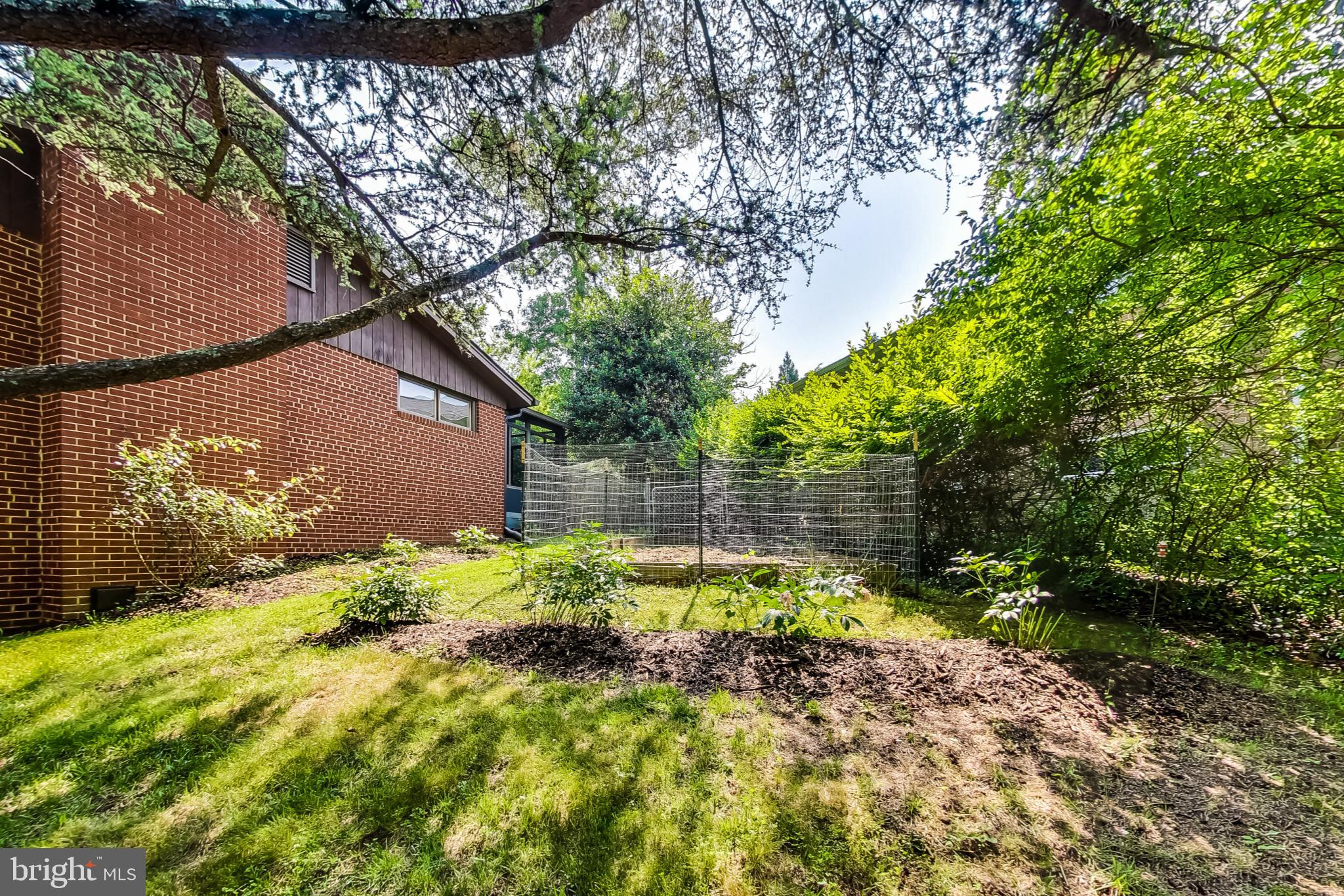 6515 East Halbert Road Bethesda, MD 20817 - Photo 34 of 42 a backyard of a house with lots of green space