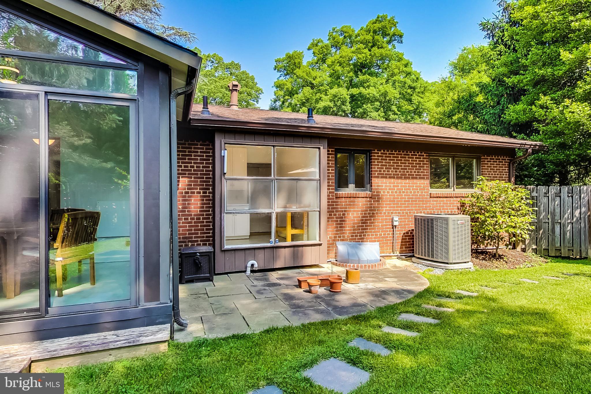 6515 East Halbert Road Bethesda, MD 20817 - Photo 37 of 42 a front view of a house with a yard