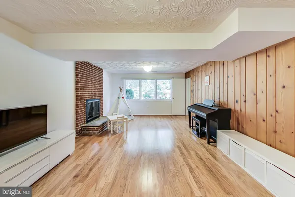 a view of a livingroom with furniture and a fireplace