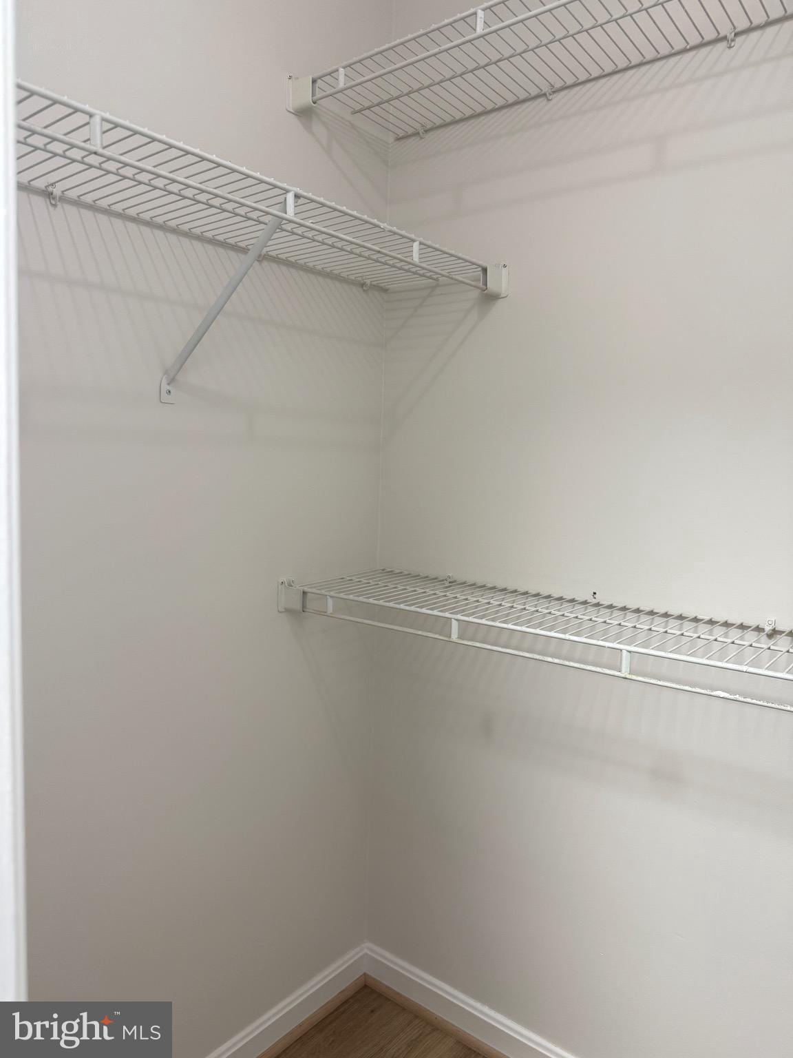 21681 Hazelnut Square, Unit 168 Sterling, VA 20164 - Photo 20 of 35 a view of a room with racks on the wall