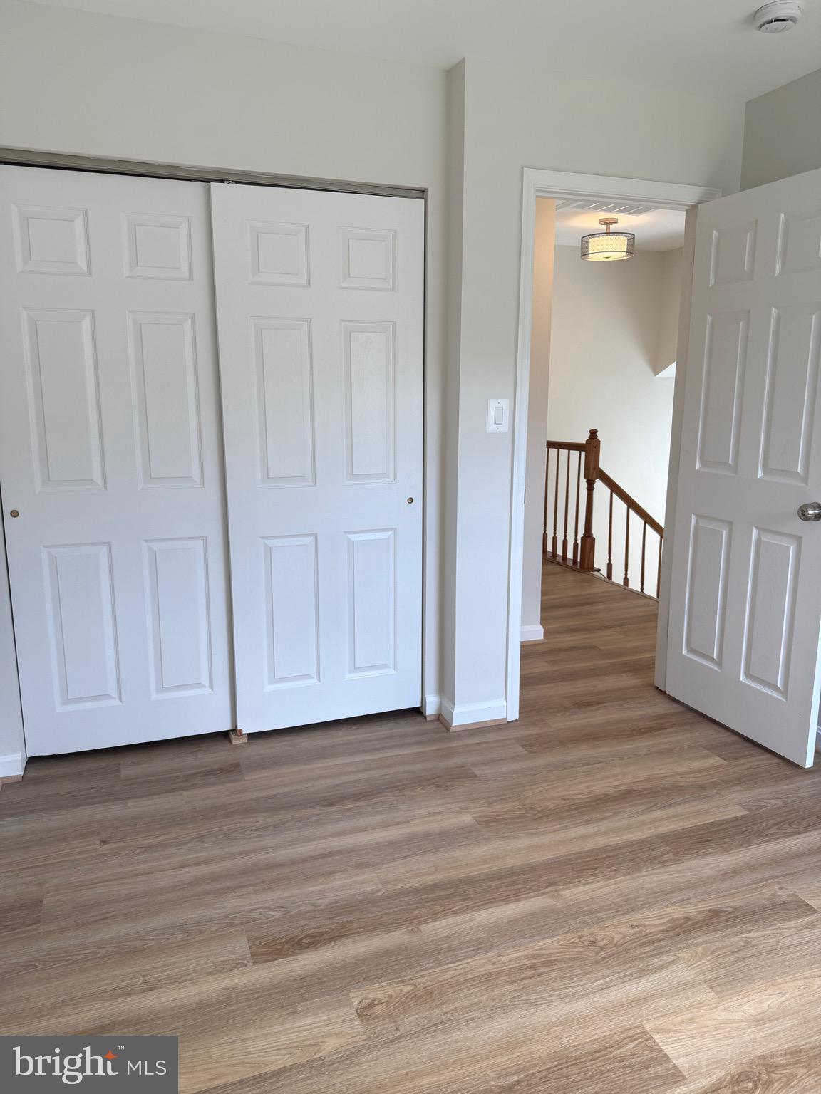 21681 Hazelnut Square, Unit 168 Sterling, VA 20164 - Photo 27 of 35 a view of entryway with wooden floor