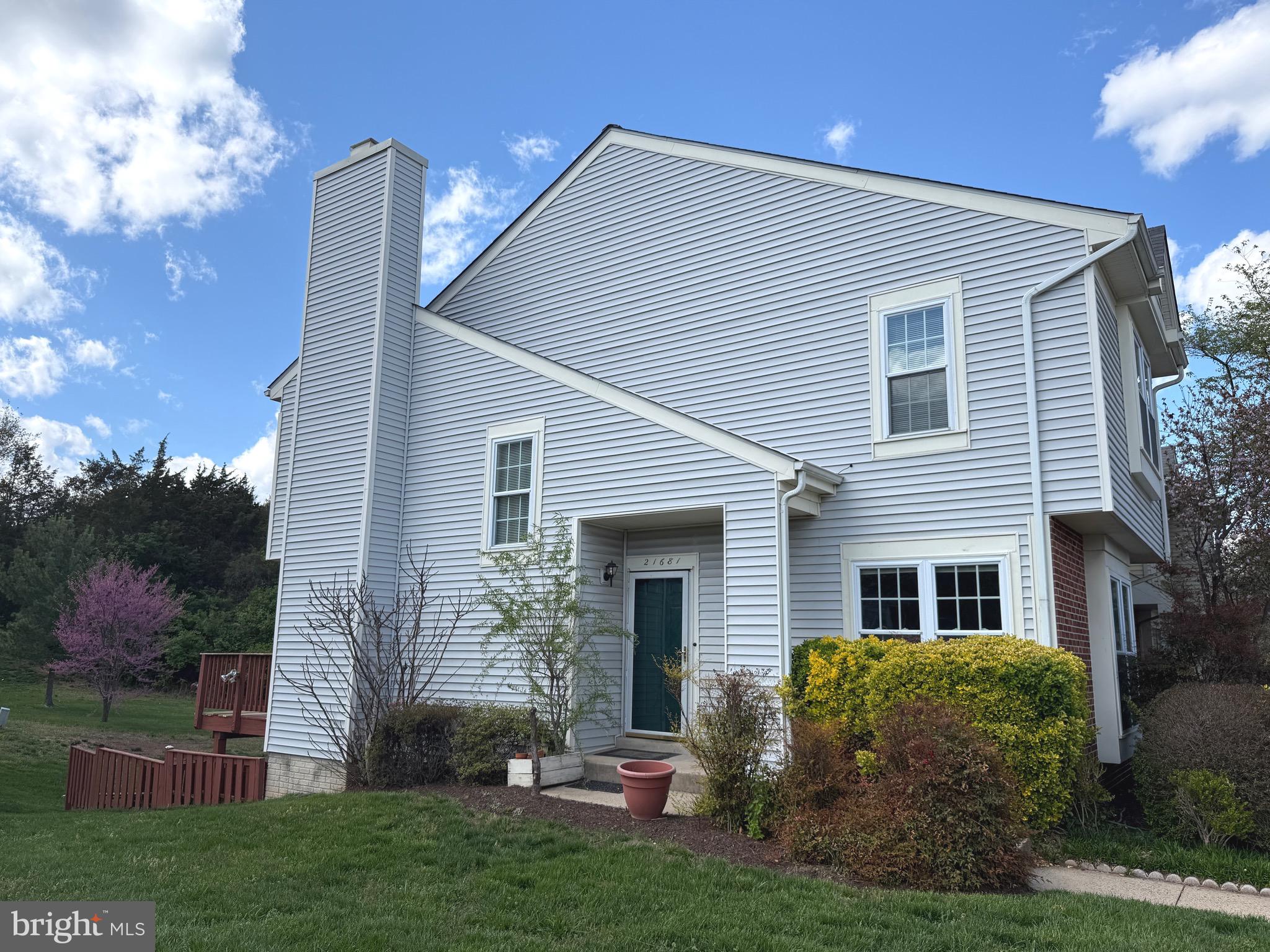 21681 Hazelnut Square, Unit 168 Sterling, VA 20164 - Photo 4 of 35 a front view of house with a garden