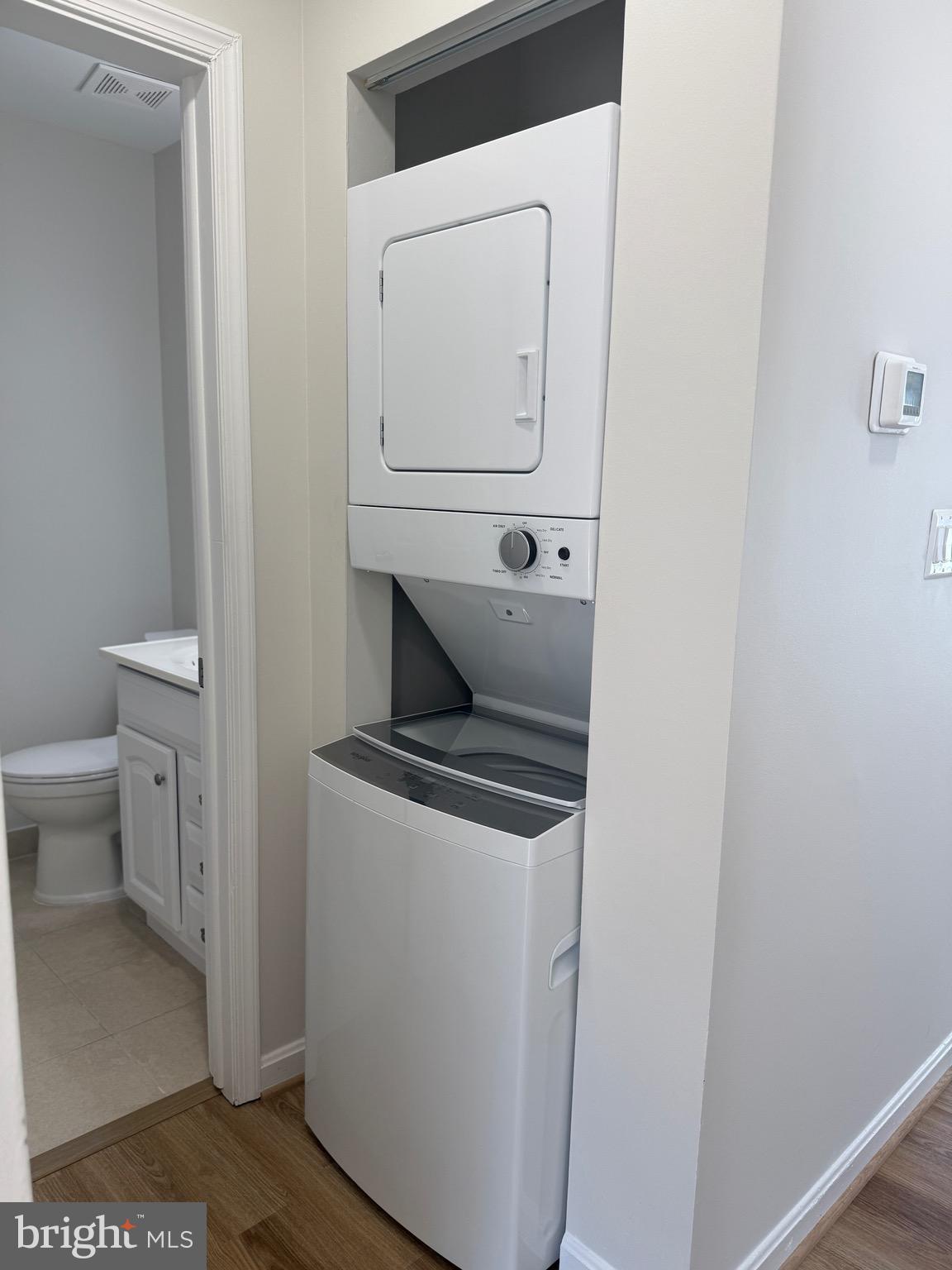 21681 Hazelnut Square, Unit 168 Sterling, VA 20164 - Photo 10 of 35 a utility room with dryer and washer
