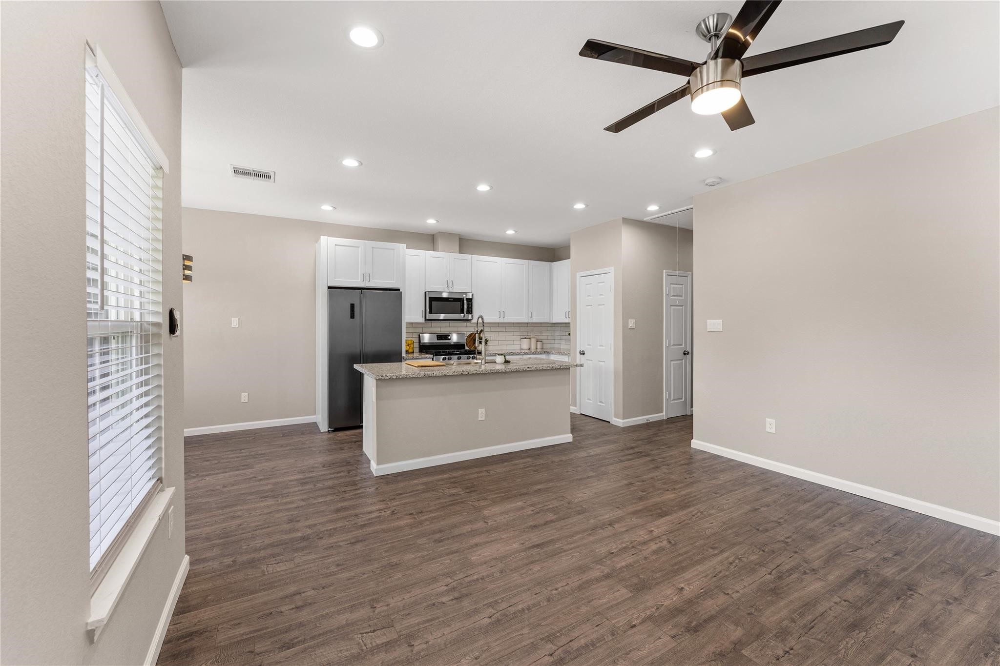 5218 Jezebel Street, Unit B Houston, TX 77033 - Photo 11 of 31 a view of kitchen with refrigerator microwave and stove