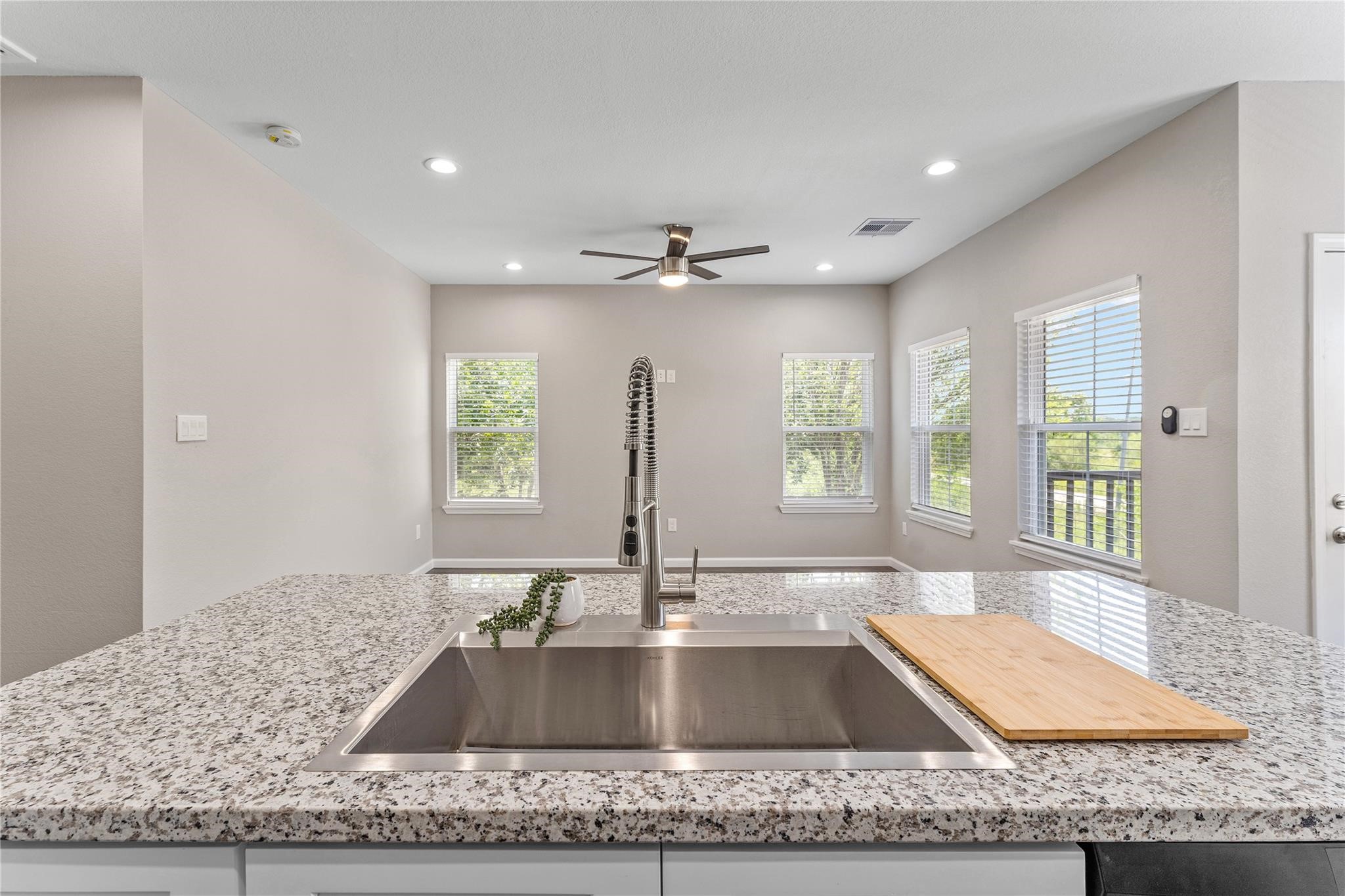 5218 Jezebel Street, Unit B Houston, TX 77033 - Photo 19 of 31 a kitchen with granite countertop a sink and a window