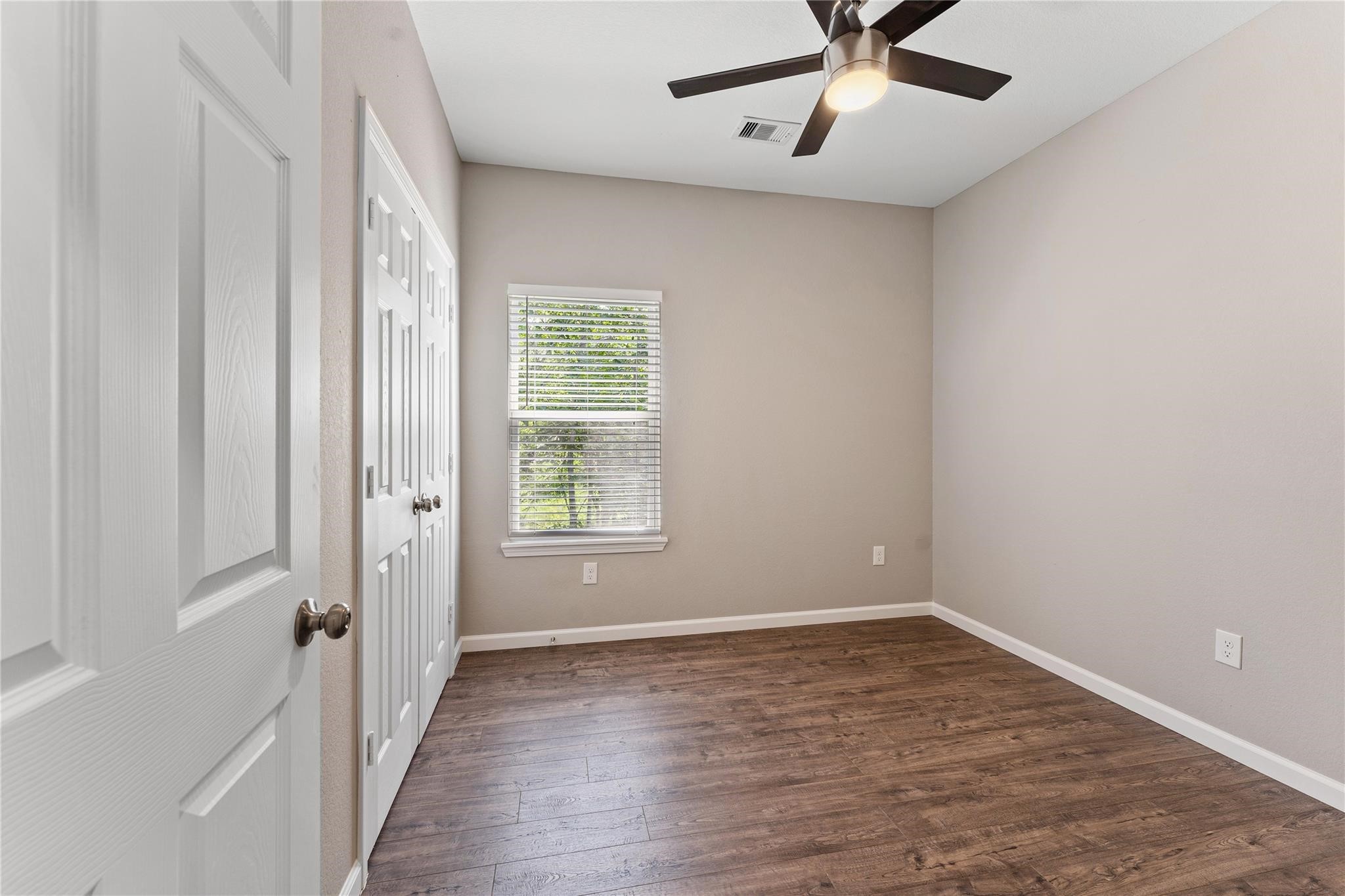 5218 Jezebel Street, Unit B Houston, TX 77033 - Photo 24 of 31 wooden floor in an empty room with a window