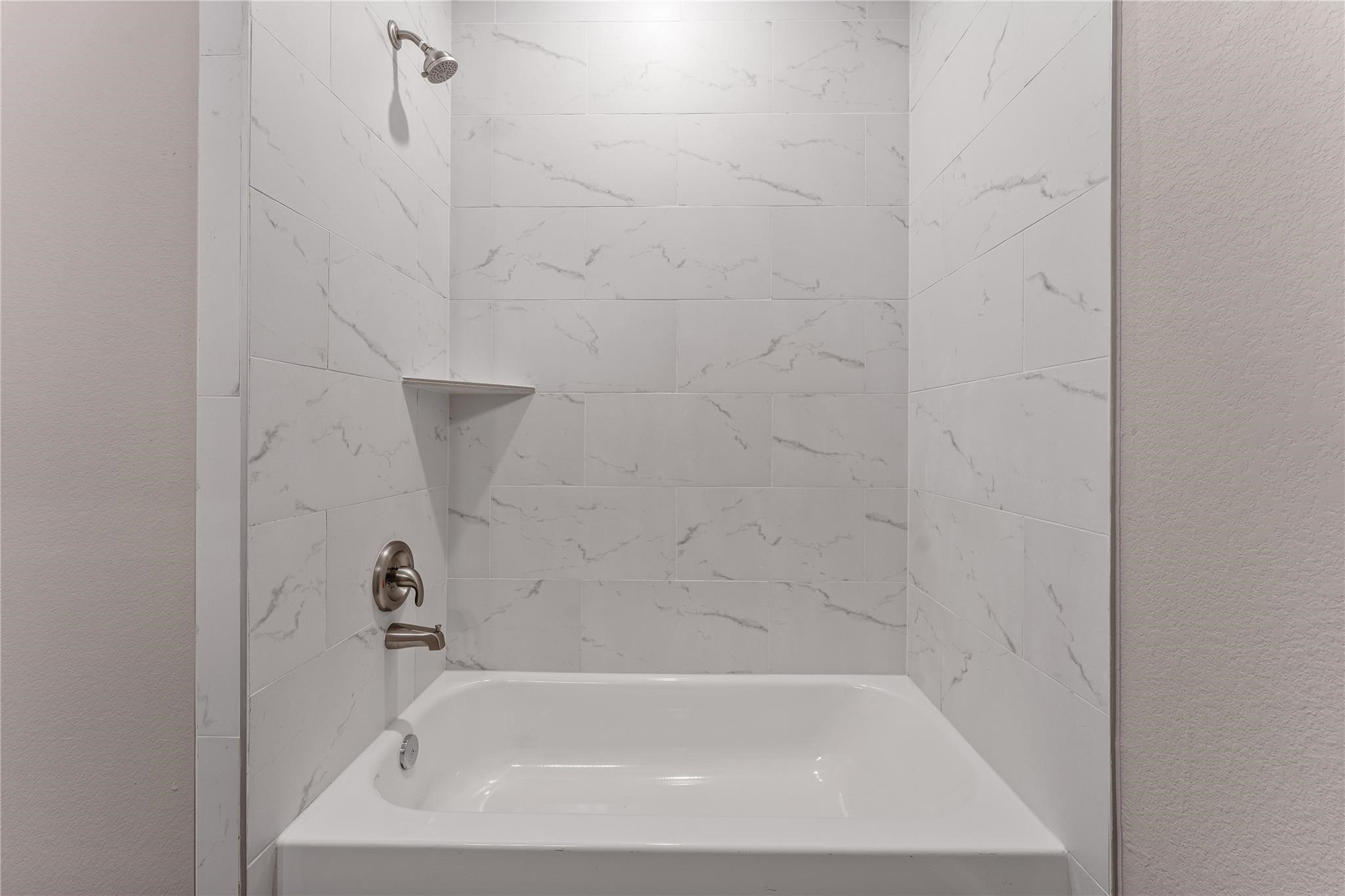 5218 Jezebel Street, Unit B Houston, TX 77033 - Photo 26 of 31 a close up of a bathtub curtain