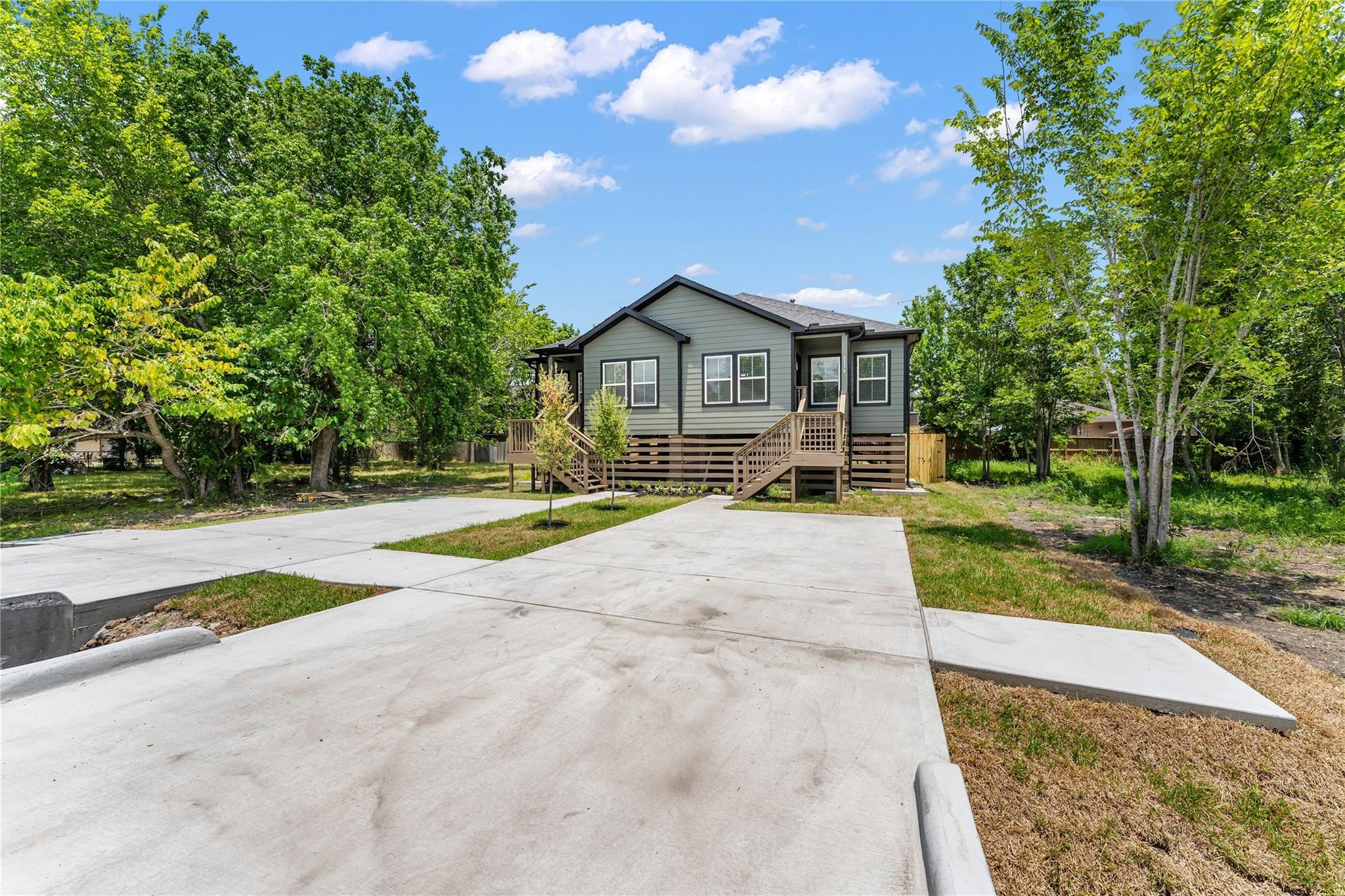 5218 Jezebel Street, Unit B Houston, TX 77033 - Photo 3 of 31 a view of a house with a yard and large trees